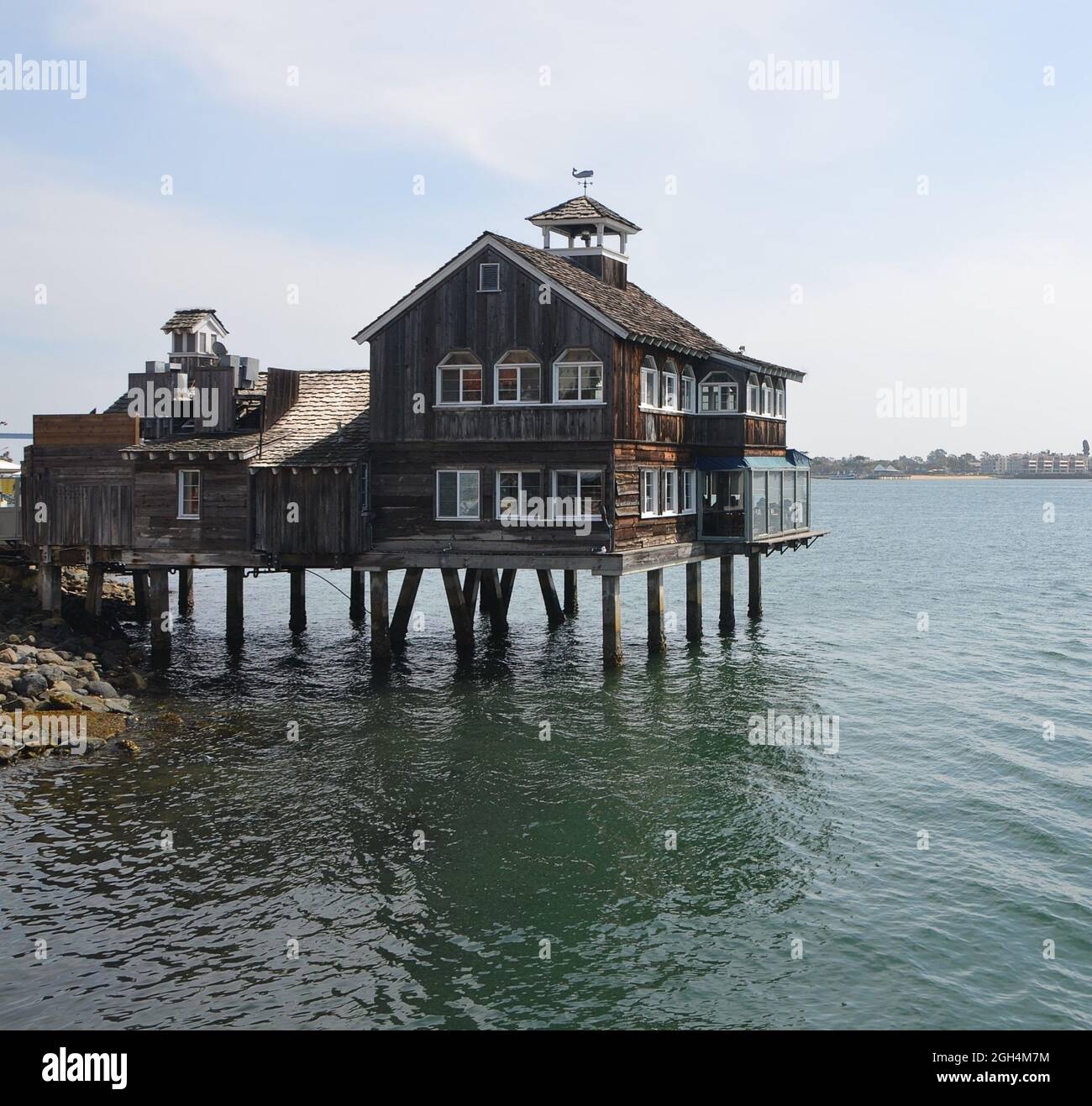 Landscape with scenic view of the Seaport Village Pier Café a family-owned restaurant  and local landmark at the San Diego Bay in California USA. Stock Photo