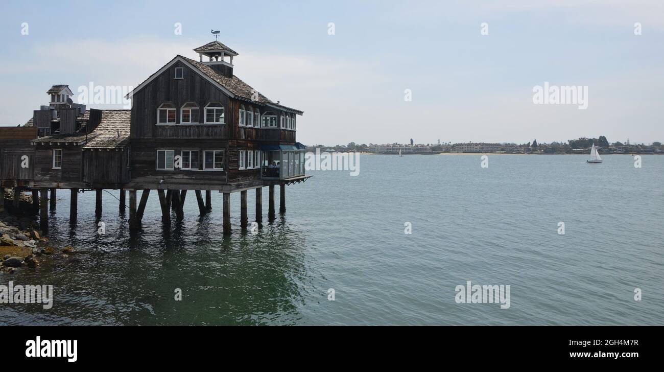 Landscape with scenic view of the Seaport Village Pier Café a family-owned restaurant  and local landmark at the San Diego Bay in California USA. Stock Photo