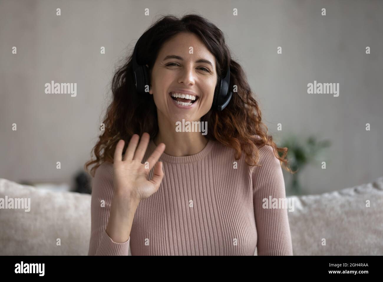 Joyful beautiful woman holding video call conversation. Stock Photo