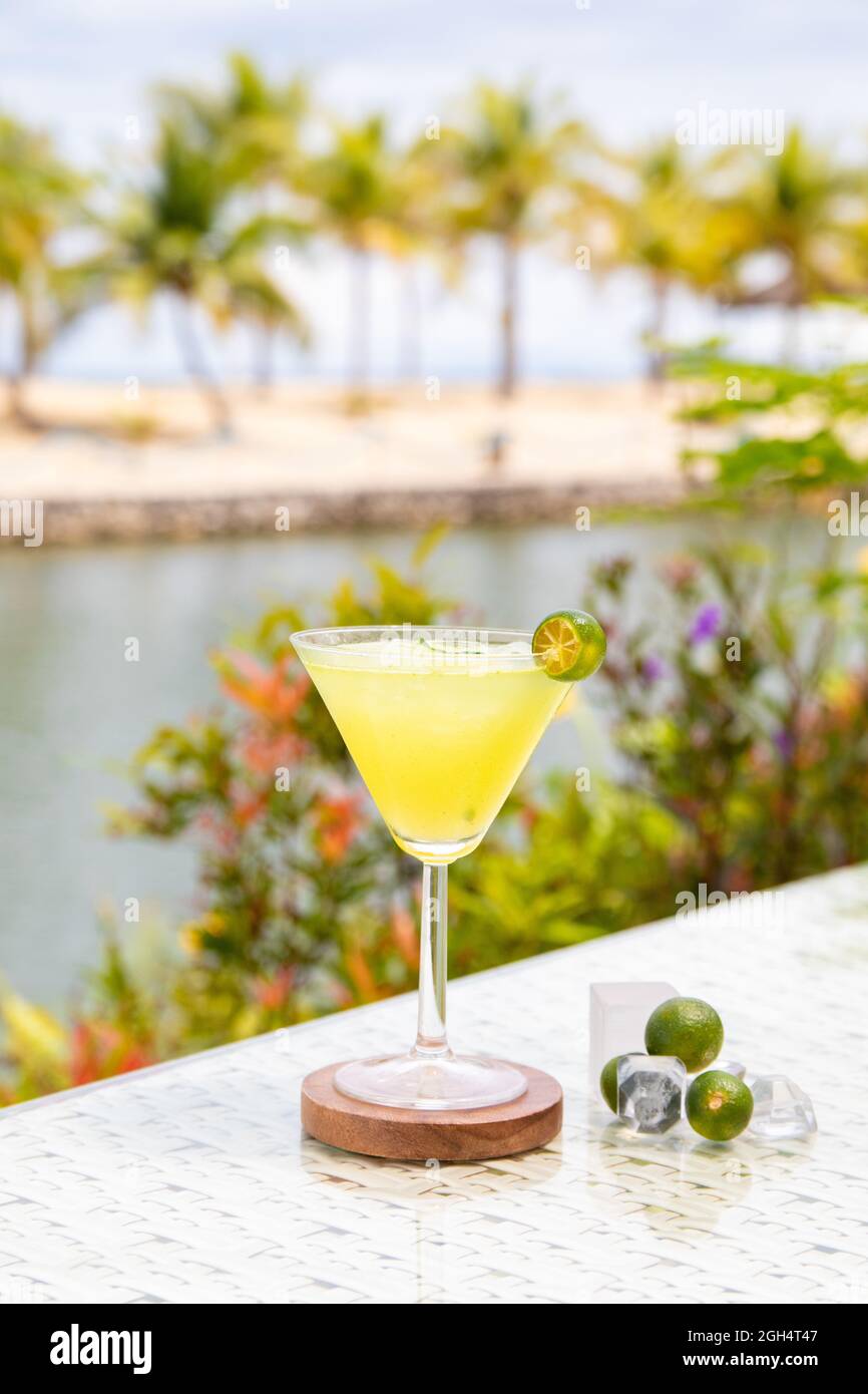 tropical martini with beach background Stock Photo Alamy