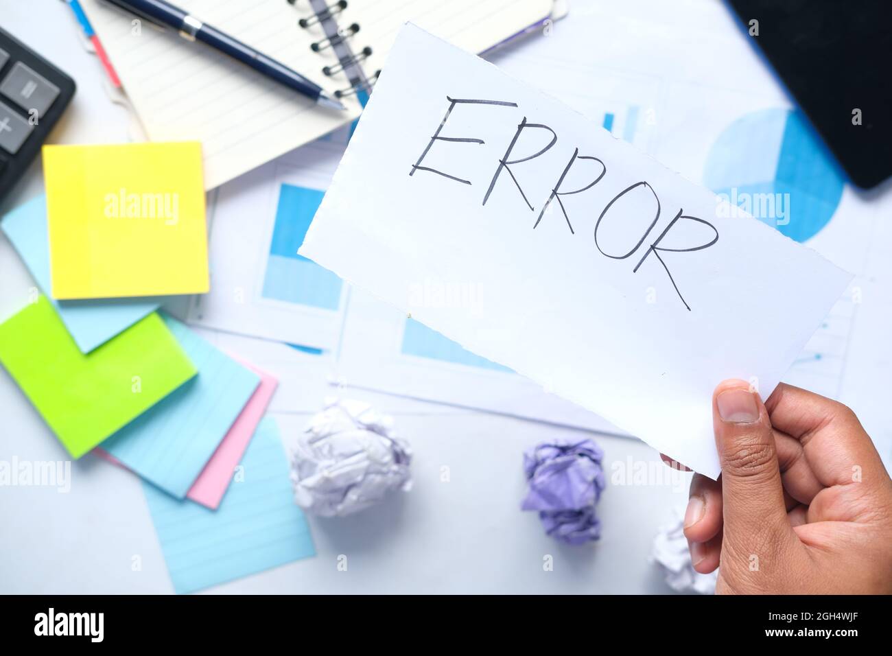 error word on paper with notepad and chart on table , Stock Photo