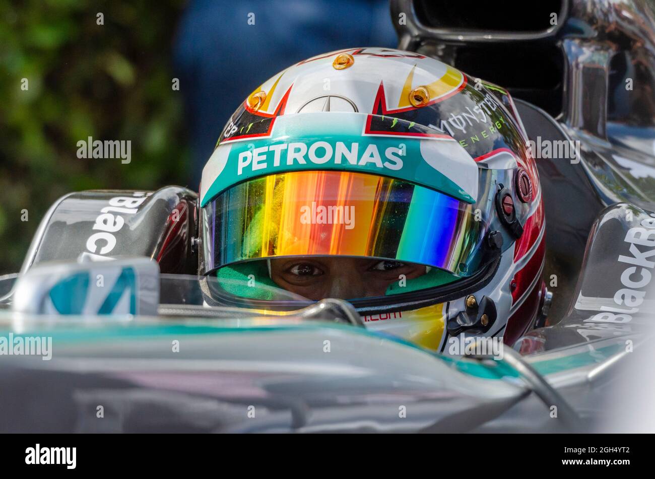 Lewis Hamilton, Mercedes Formula 1 Grand Prix racing driver in the cockpit of Petronas Mercedes F1 car at Goodwood. Eyes peering out from helmet Stock Photo