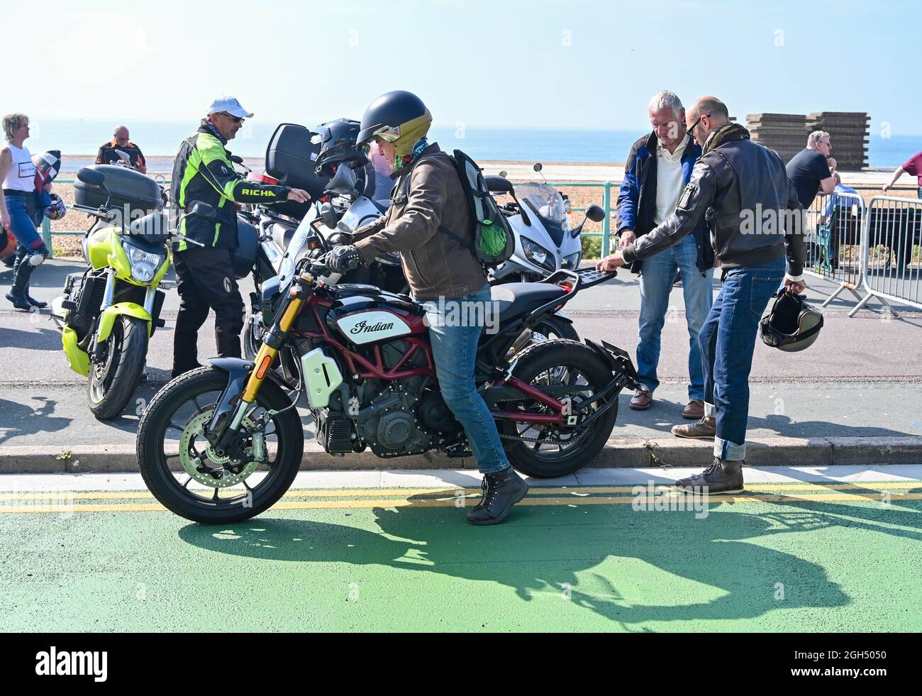 Brighton UK 5th September 2021 - Thousands of bikers including this one on an old Indian motorcycle at the Ace Cafe Reunion Brighton  Burn Up event held along Madeira Drive on the seafront . The event is acclaimed as one of the best motorcycle events in the World and celebrates the famous North London Ace cafe which closed in 1969 and then reopened in 2001 from where bikers set off from in the morning and ride to Brighton : Credit Simon Dack / Alamy Live News Stock Photo