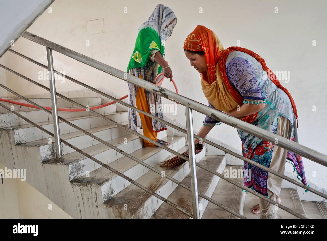 Dhaka, Bangladesh September 05, 2021 Women are busy cleaning classroom at Motijheel