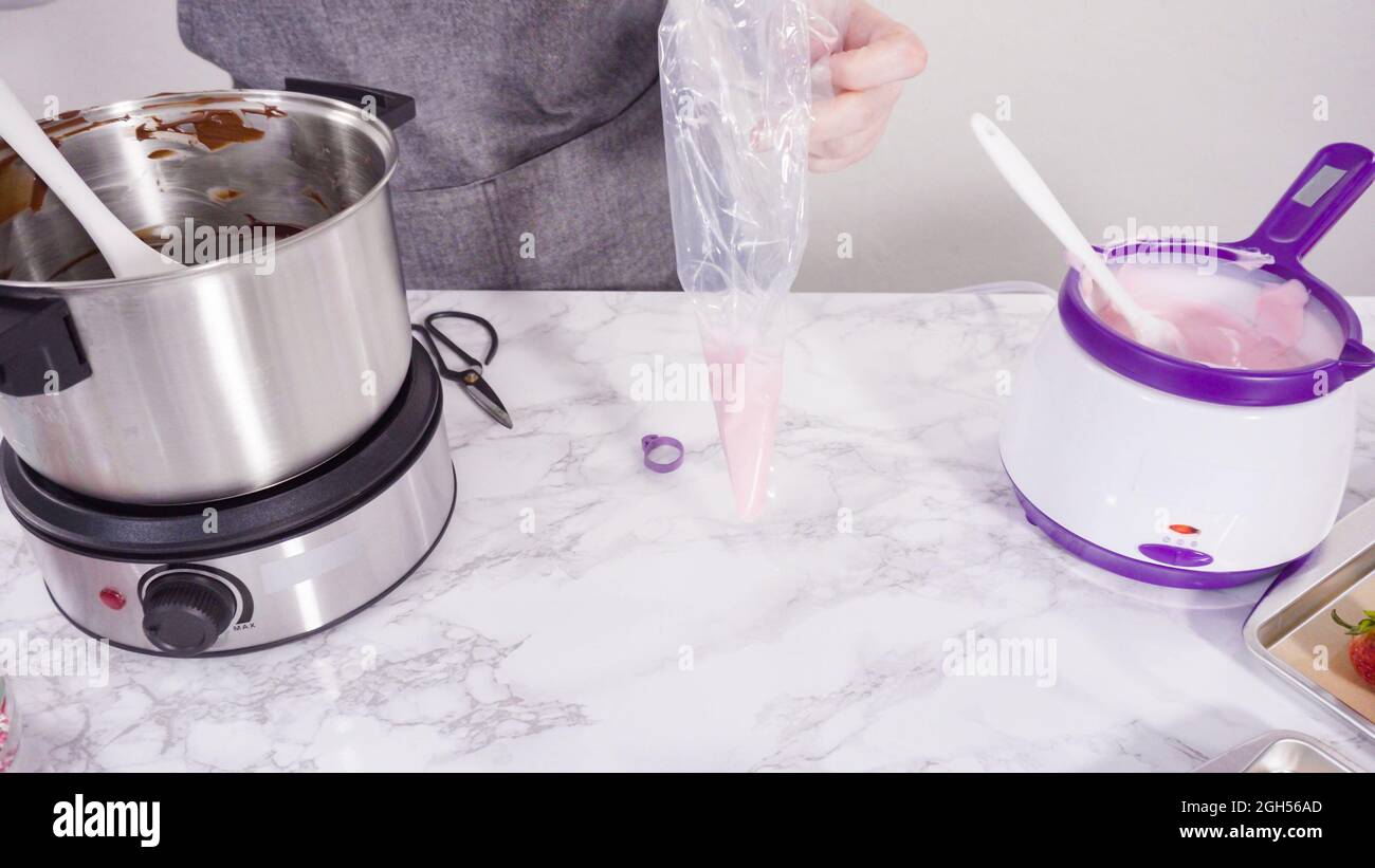 Step by step. Melting chocolate chips in chocolate melting pots Stock Photo Alamy