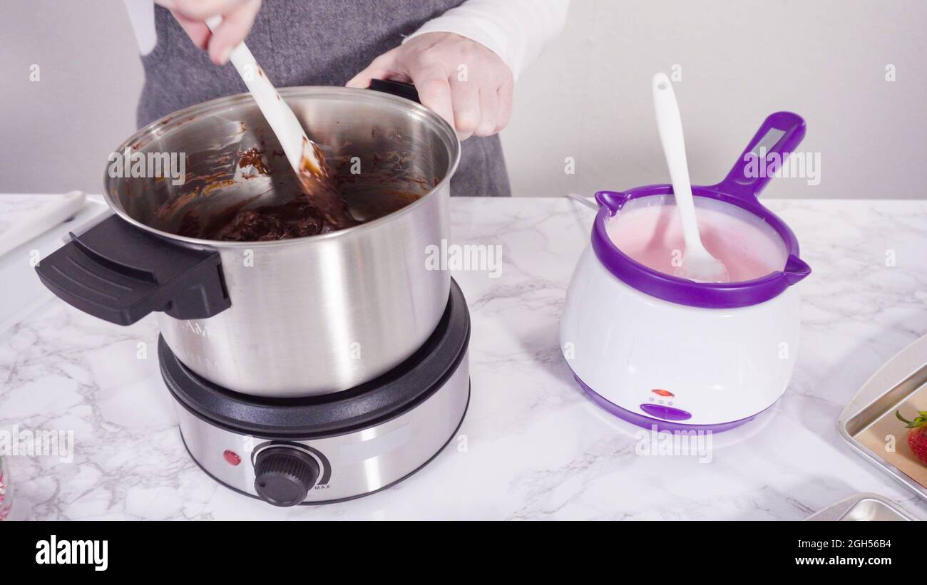 Step by step. Melting chocolate chips in chocolate melting pots Stock Photo Alamy