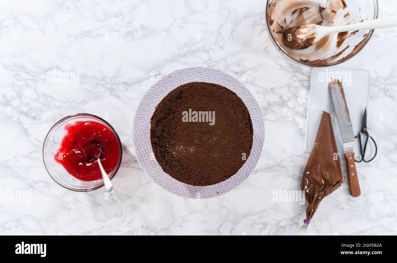 Flat lay. Covering chocolate cake with a crumb layer of chocolate