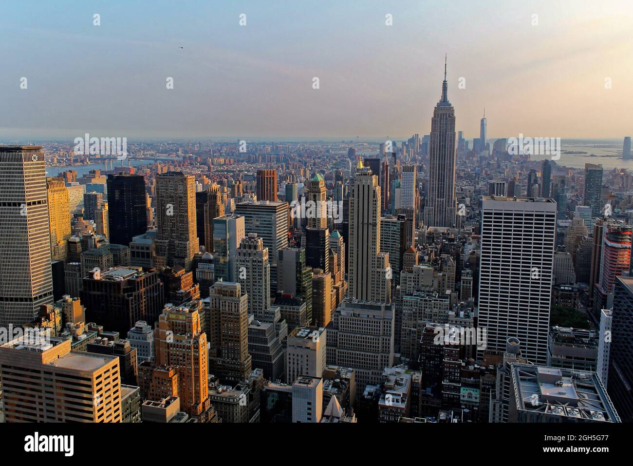 New York City, USA - August 6, 2014: The Empire State Building, One World Trade Center, Times Square, and the skyline of downtown Manhattan at sunset Stock Photo