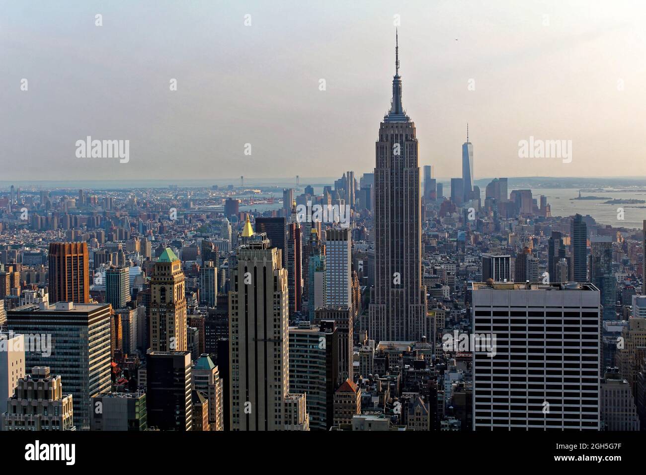 New York City, USA - August 6, 2014: The Empire State Building, One World Trade Center, Times Square, and the skyline of downtown Manhattan at sunset Stock Photo