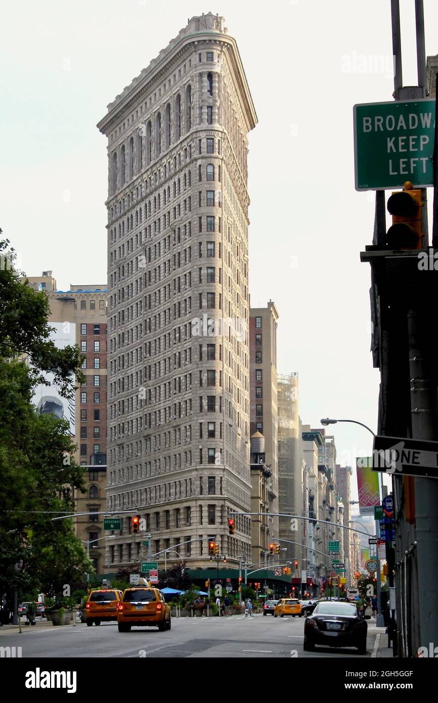 The Flatiron Building is a triangular 22-story steel-framed landmarked building located at 175 Fifth Avenue in the borough of Manhattan, USA, New York Stock Photo