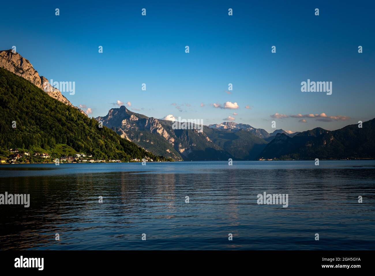 Panoramic view of Traunsee lake during sunset, landscape photo of lake and mountains near Gmunden, Austria Stock Photo