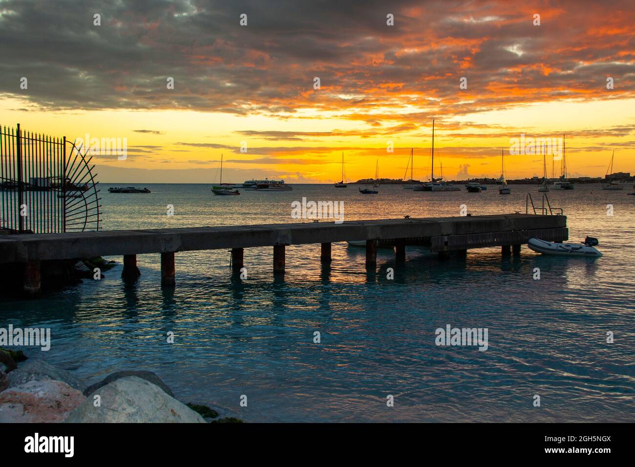 old pier in the sea against the backdrop of the sunset sky in summe Stock Photo