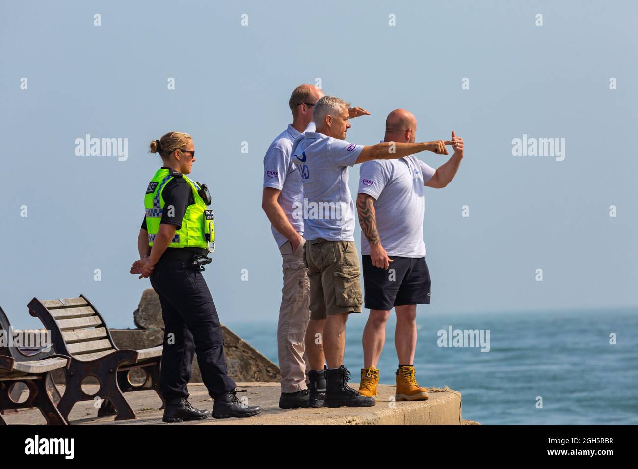 Sandbanks, Poole, Dorset UK. 5th September 2021. Preparation work gets underway to lift the plane that ditched into the sea at Sandbanks during yesterdays display by The AeroSuperBatics Wingwalkers during the Bournemouth Air Festival. Divers observe the scene. Credit: Carolyn Jenkins/Alamy Live News Stock Photo