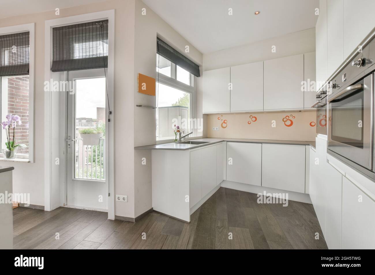 Interior design of minimalist open plan kitchen with built in ...