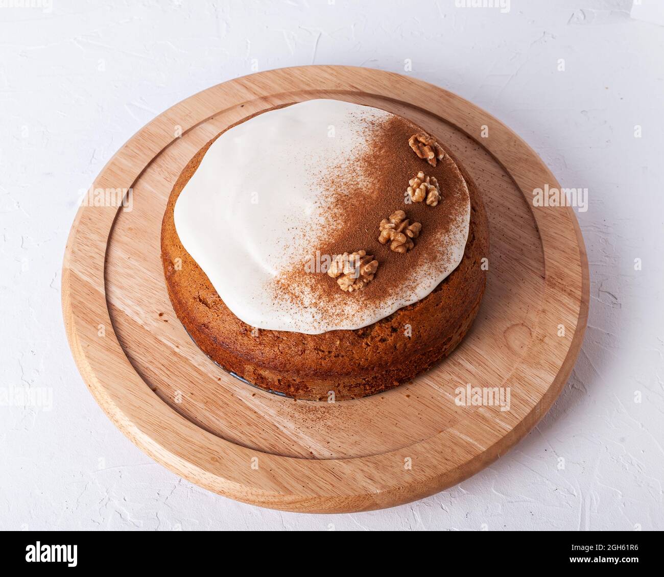 Top View Of Tasty Carrot Cake With Walnuts And Cinnamon Powder On Icing Sugar Glaze On Light Background Stock Photo Alamy