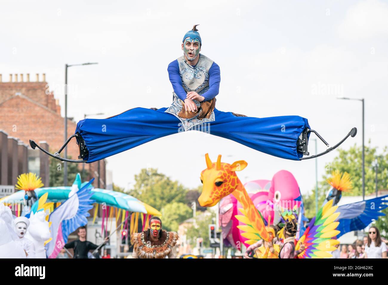 Costumed performers, giant puppets and inflatables during the the Earth