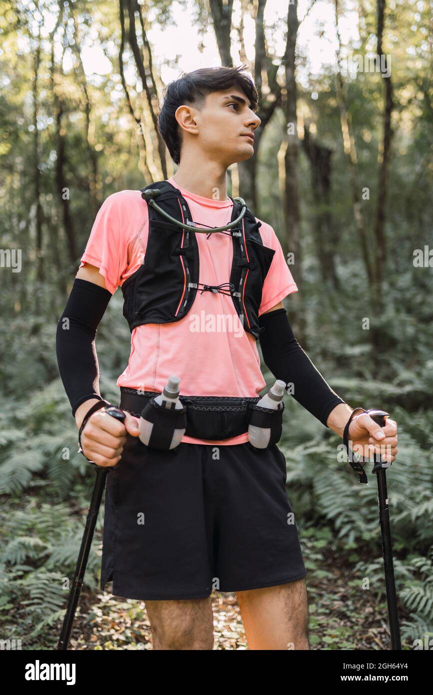 Man trekking in forest hi-res stock photography and images - Alamy
