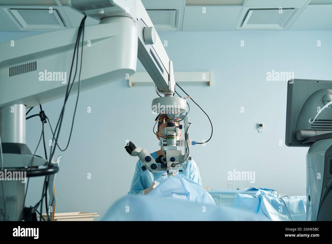 Attentive Female Doctor In Surgical Uniform And Sterile Mask Looking ...