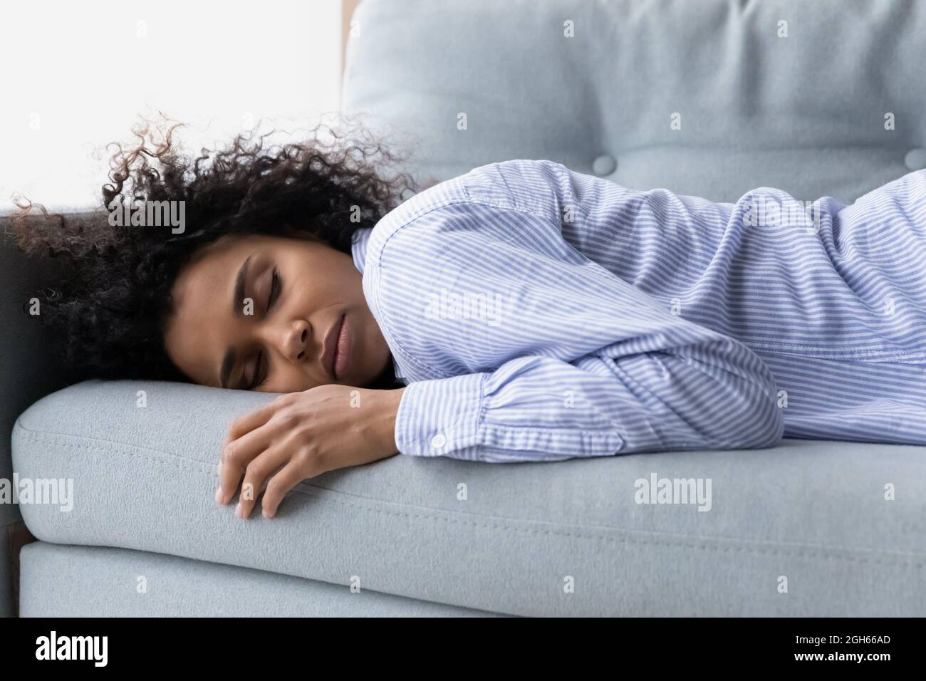 Black girl asleep couch hi-res stock photography and images photo