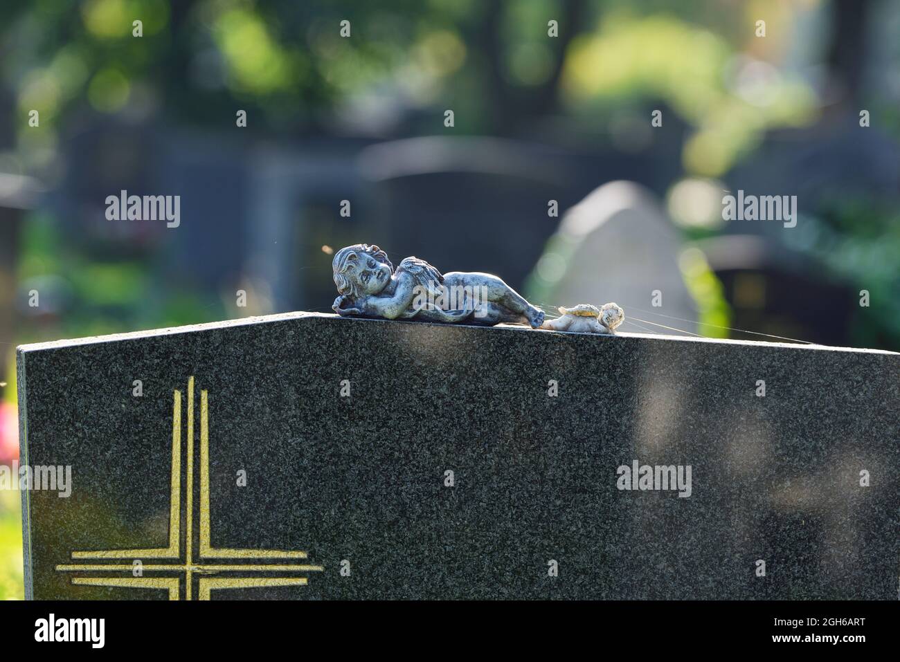 Vienna, Austria. The Vienna Central Cemetery. Two small angel figures on a tombstone Stock Photo