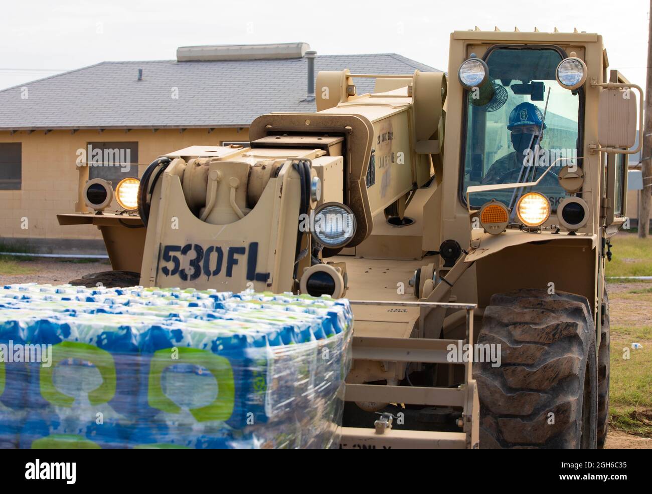 Spc. Ricardo Pabon, motor transport operator assigned to 1st Battalion, 6th Infantry Regiment, 2nd Brigade Combat Team, 1st Armored Division, delivers a pallet of water to one of the drop points at Fort Bliss’ Doña Ana Complex in New Mexico, Sept. 4, 2021. The Department of Defense, through U.S. Northern Command, and in support of the Department of Homeland Security, is providing transportation, temporary housing, medical screening, and general support for at least 50,000 Afghan evacuees at suitable facilities, in permanent or temporary structures, as quickly as possible. This initiative provi Stock Photo