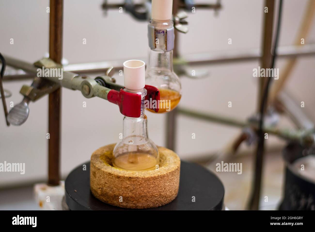 Round bottom flask with yellow liquid for for advance chemical