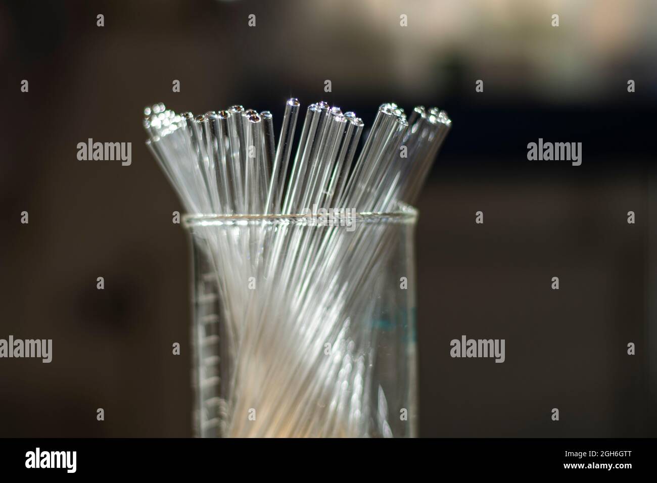 Various clean NMR tubes in a beaker in a chemistry laboratory for biotechnology research for drug development Stock Photo