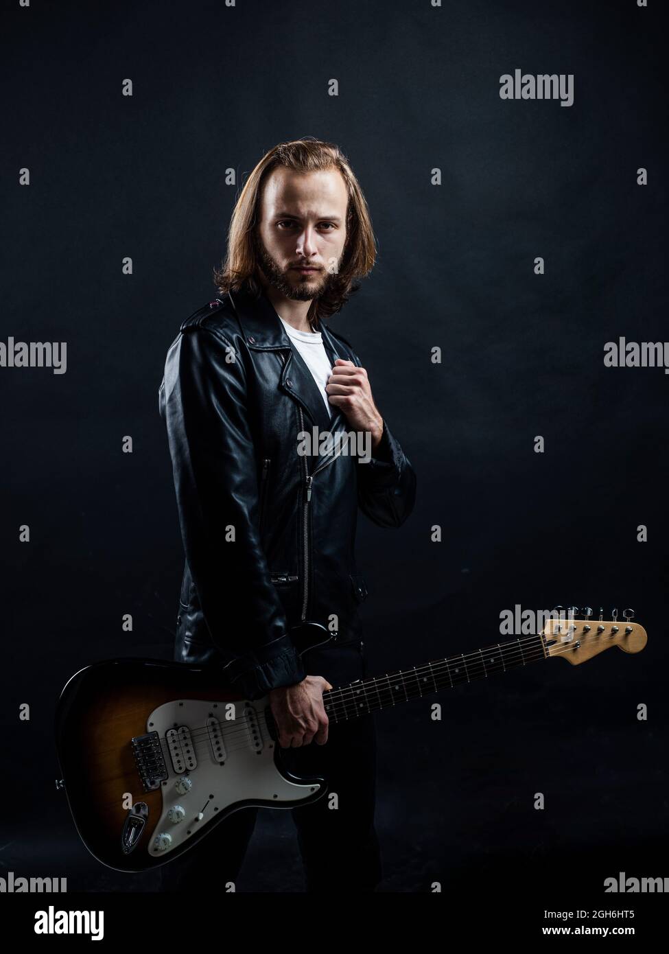 serious man long hair play electric guitar. rock music style. musician guitar player Stock Photo - Alamy serious man long hair play electric guitar. rock music style. musician guitar player Stock Photo - Alamy