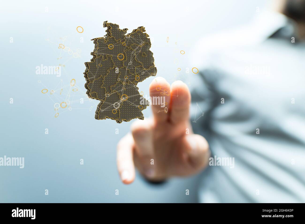 A hand touching the hologram of the German map Stock Photo - Alamy