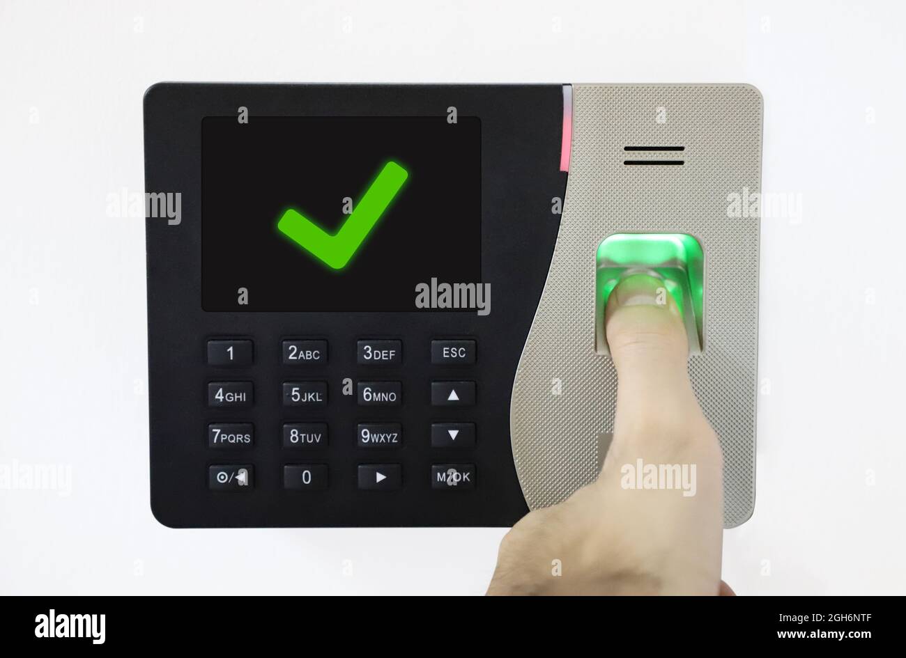 Biometric Fingerprint Scanner. Thumb on fingerprint. access control verified. successful entrance. Stock Photo