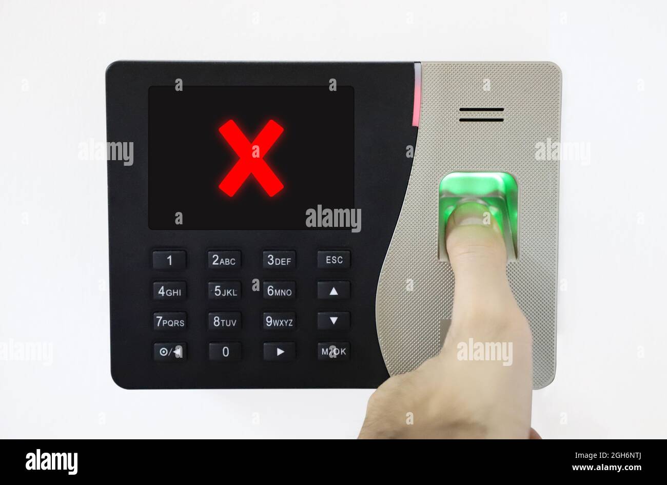 Biometric Fingerprint Scanner. Thumb on fingerprint. access control denied. unsuccessful entry. Stock Photo