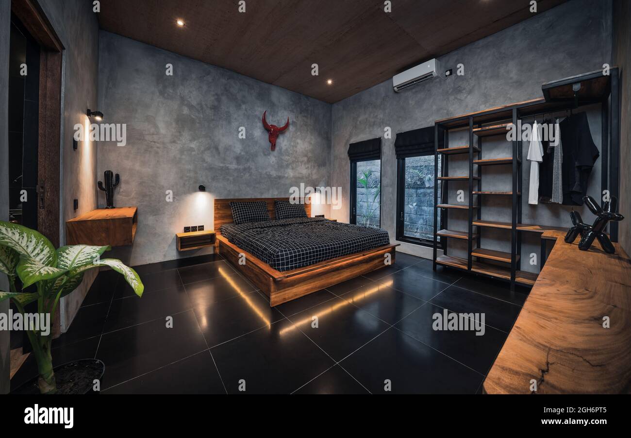 Luxury dark bedroom with modern wooden bed in loft style interior design  room Stock Photo - Alamy