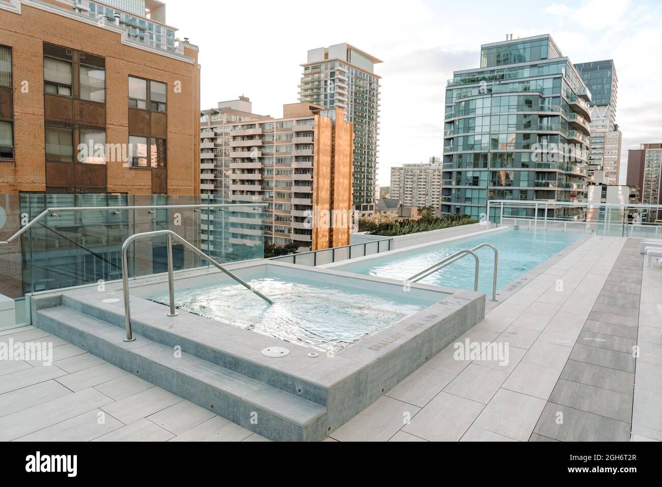 small empty swimming pool on the rooftop of a building overlooking ...