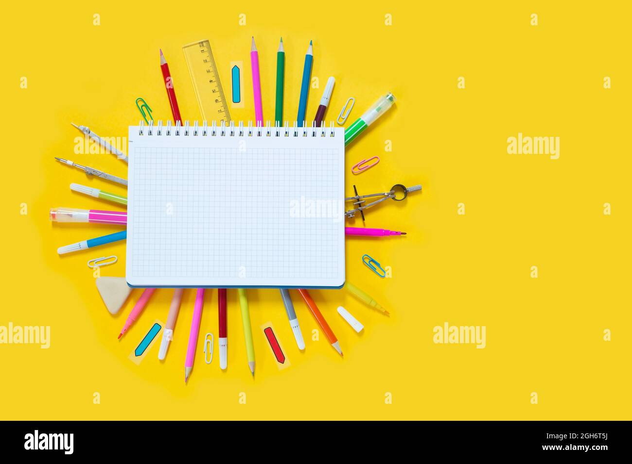 School suplies on yellow background Stock Photo