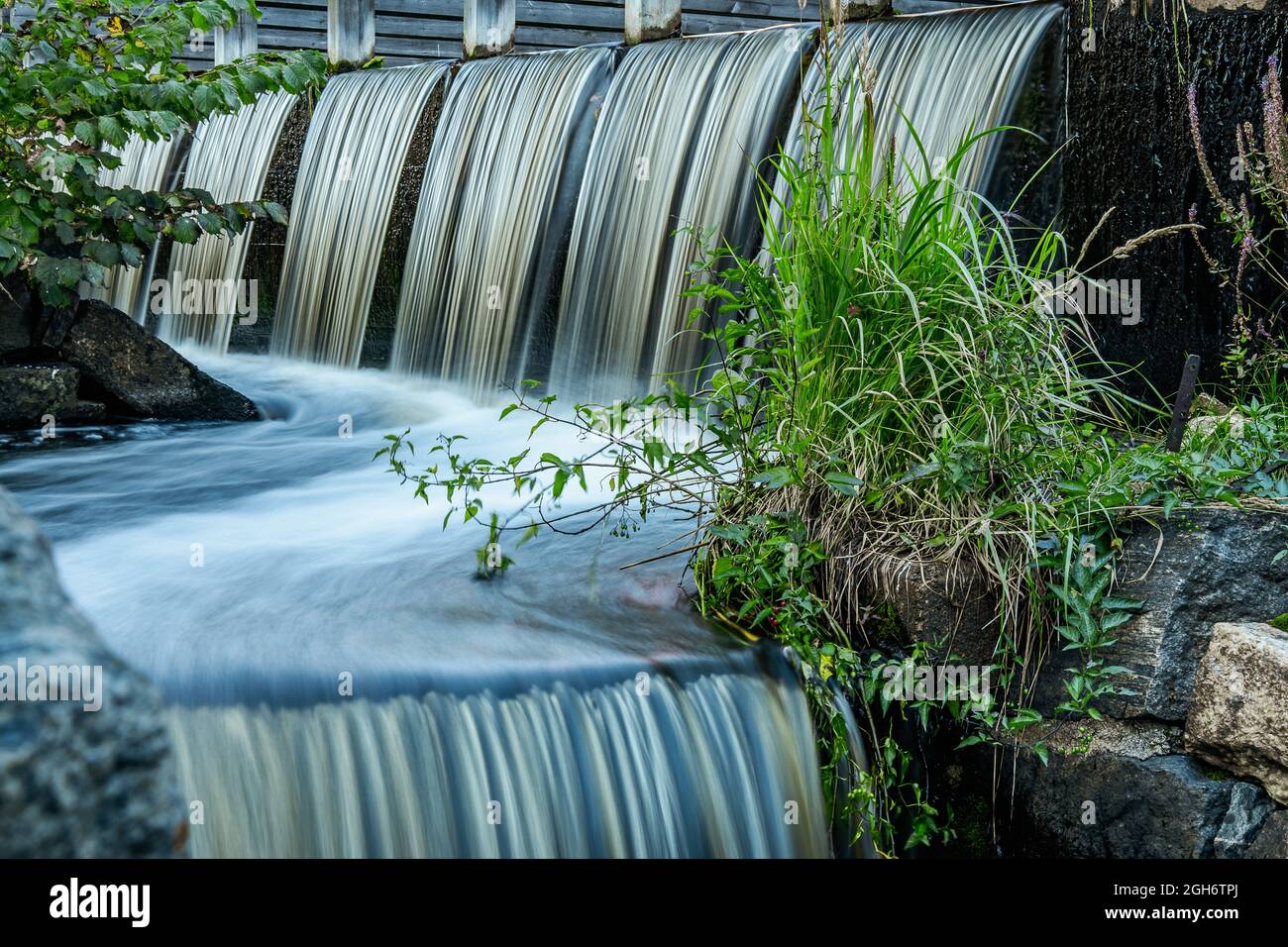 Waterfall from an old watermill located in Forsmark Sweden Stock Photo