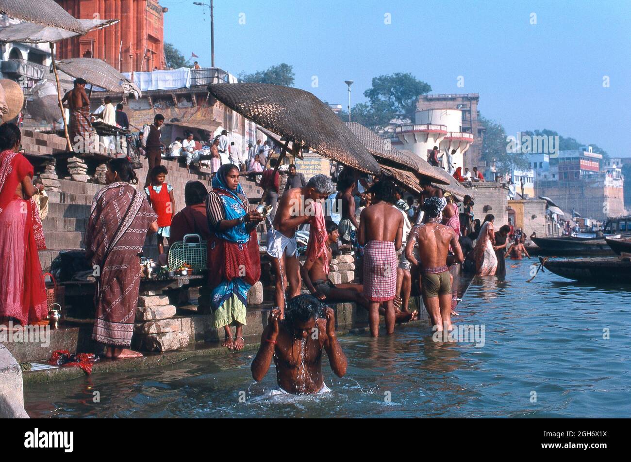 Bathing from the ghats at sacred hindu site River Ganges, Varanasi, Uttar Pradesh, India Stock Photo