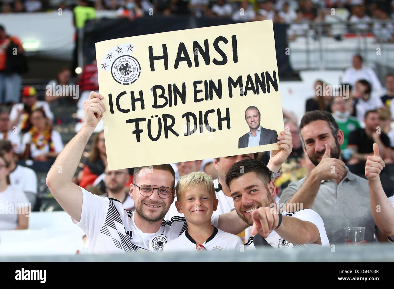 Stuttgart, Germany. 05th Sep, 2021. Football: World Cup Qualification Europe, Germany - Armenia, Group Stage, Group J, Matchday 5, Mercedes-Benz Arena. A fan of the German national team holds a sign reading 'Hansi ich bin ein Mann für dich' before the start of the match. Credit: Tom Weller/dpa/Alamy Live News Stock Photo