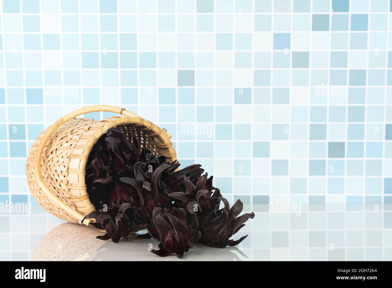 Roselle fruits poured out from rattan container. Roselle has many great