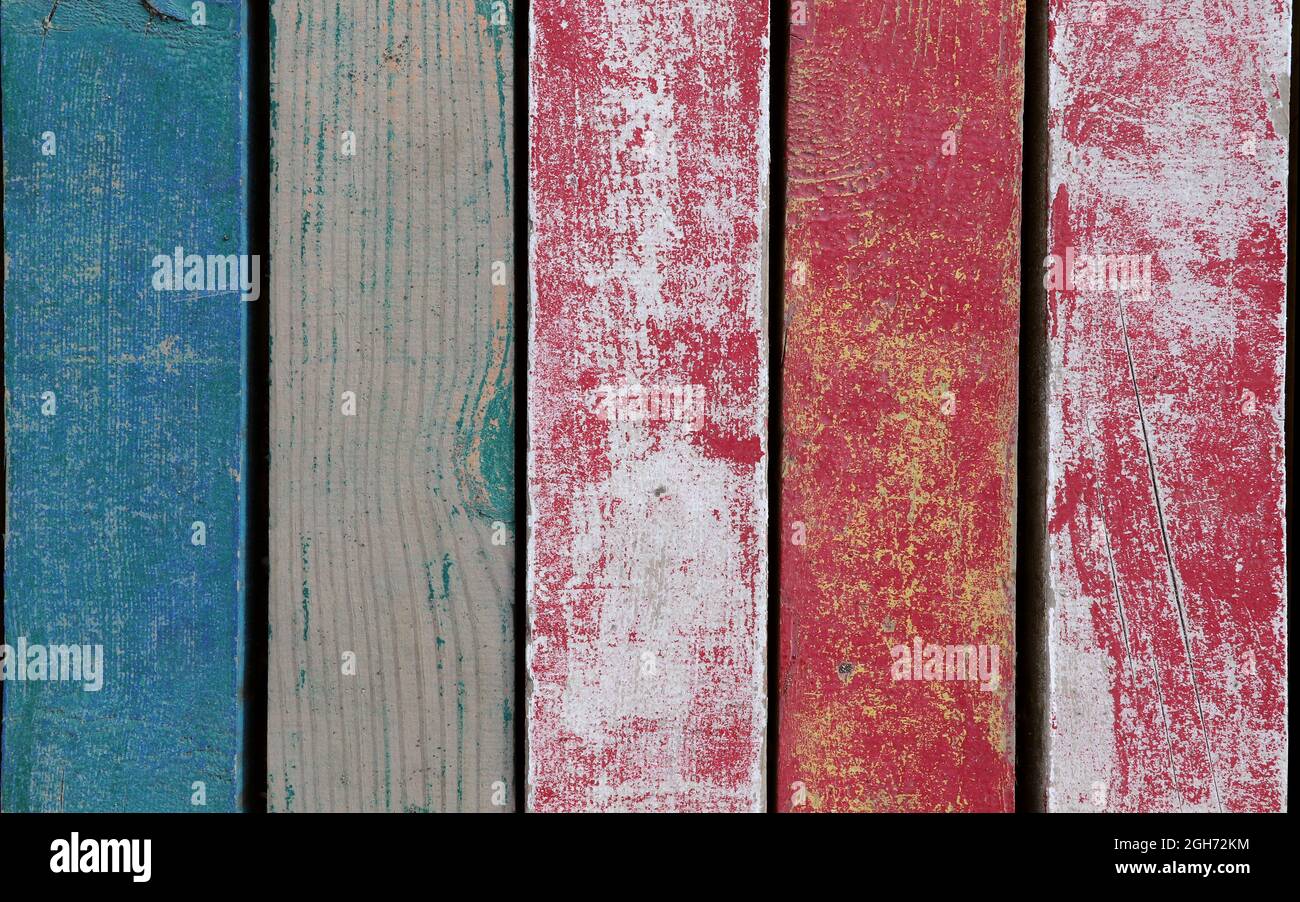 Old wooden texture with grunge blue and red paints. Wood texture in vintage style. Blue and red vintage wooden background. Stock Photo