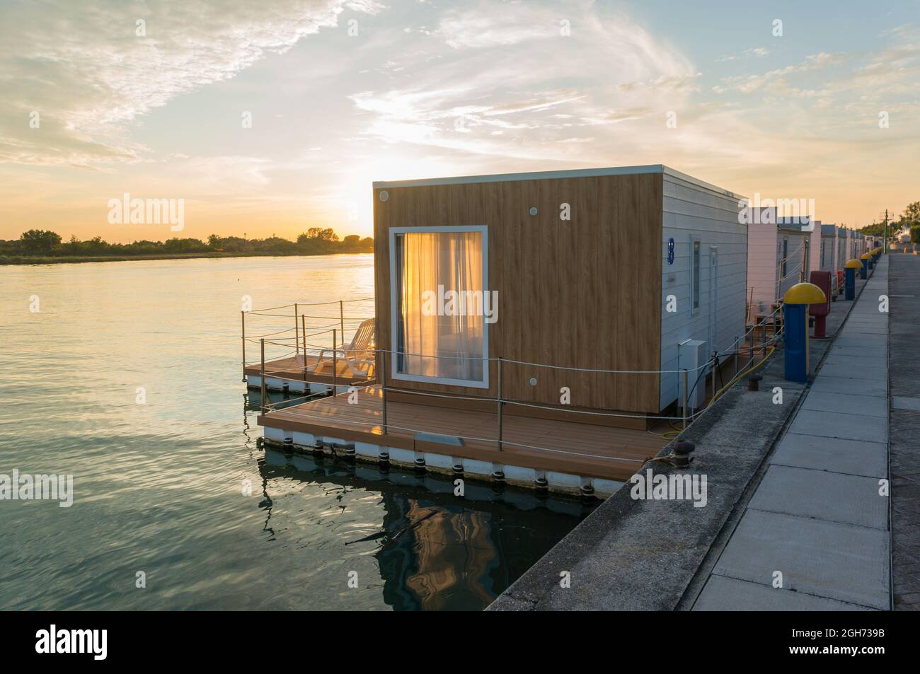Lignano Sabbiadoro, Italy (3rd September 2021) - Floating houses on the mouth of river Tagliamento at sunset Stock Photo