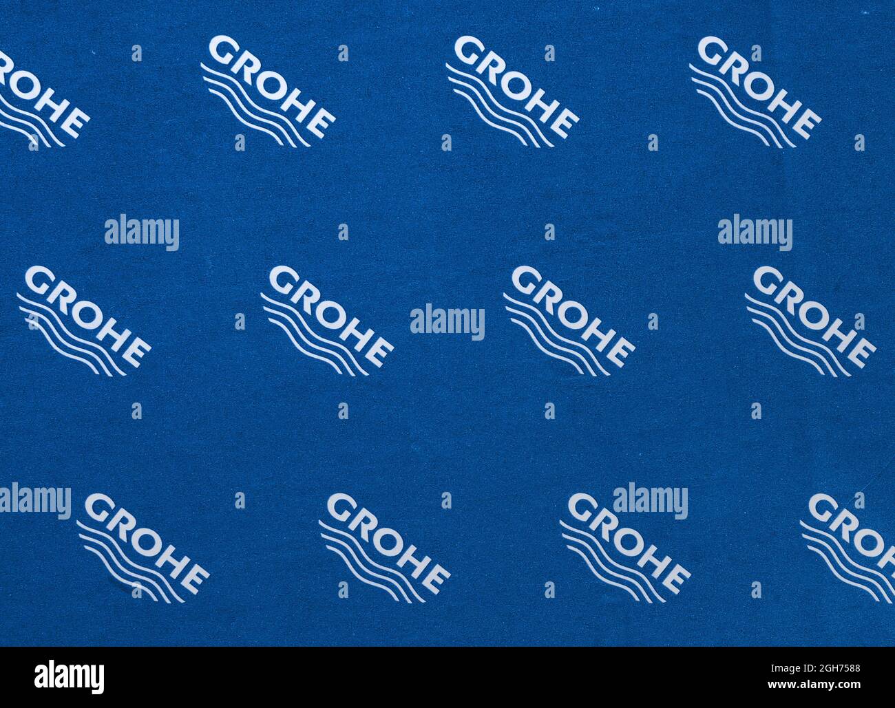 logo sign pattern like on firm blue coloration package cardboard. Grohe is german manufacturer of luxury plumbing ware Stock Photo
