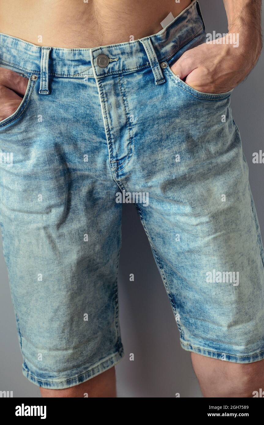 man dressed new aged denim shorts, closeup Stock Photo