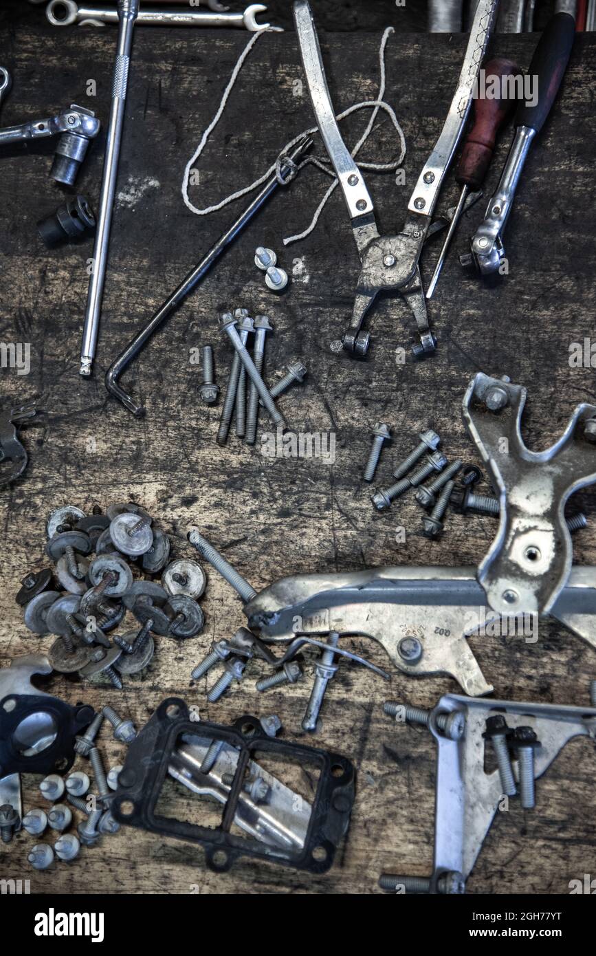Bolts and nuts ready to go back into engine bay on car on a garage Stock Photo Alamy