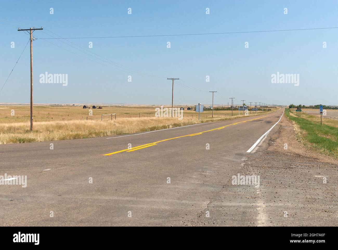 Two lane county road through farm country Stock Photo