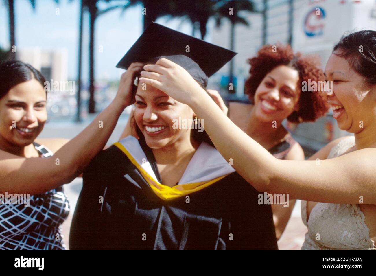 Miami Florida,Miami Dade College,school campus graduation ceremony Hispanic woman female women students friends,gown cap Stock Photo