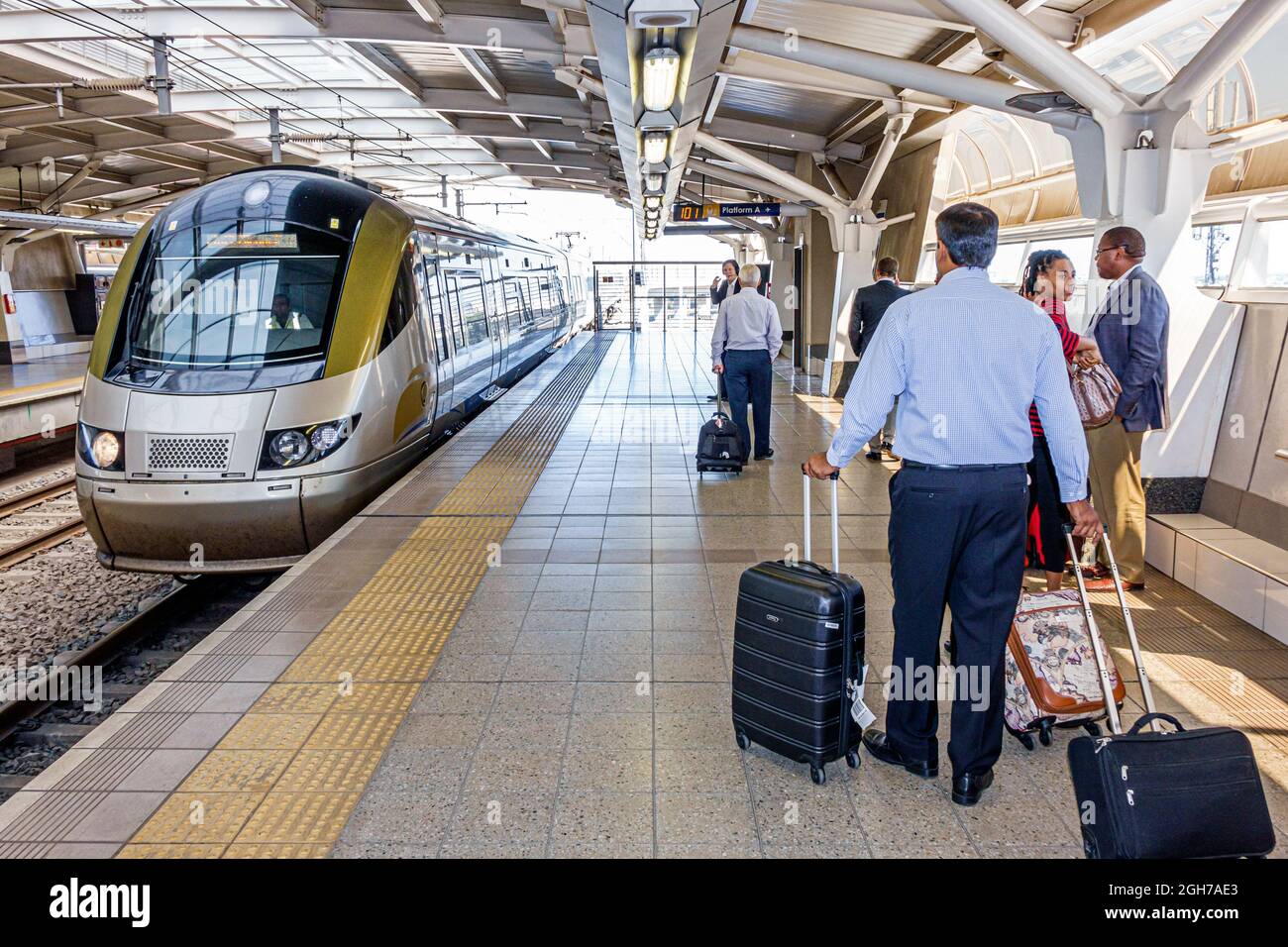 Johannesburg South Africa,JNB OR Tambo International Airport,Gautrain Station train platform arriving passengers riders luggage Stock Photo