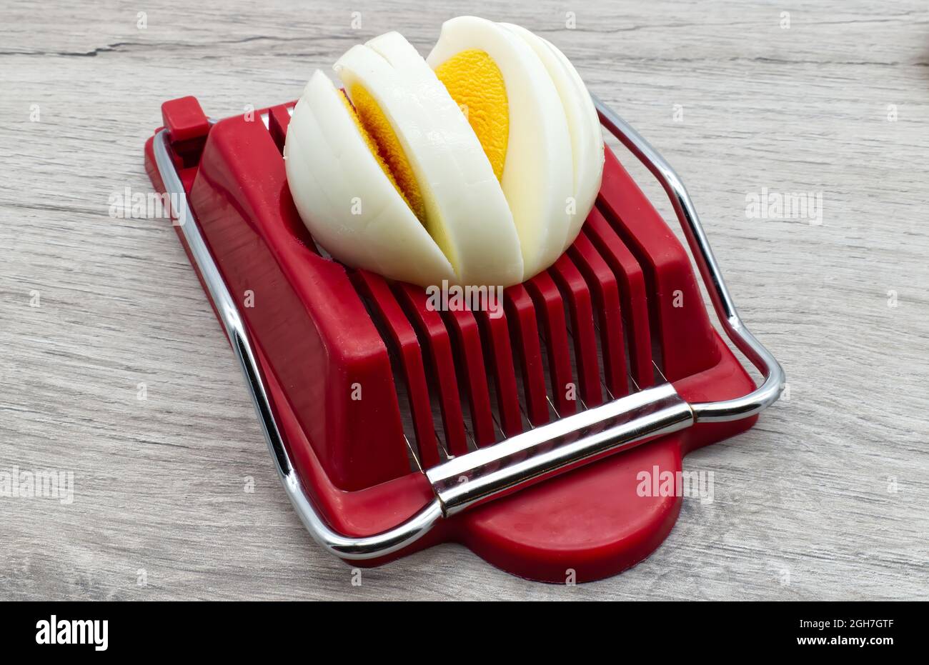 Hard boiled egg slicer tool. Household device for slicing egg Stock