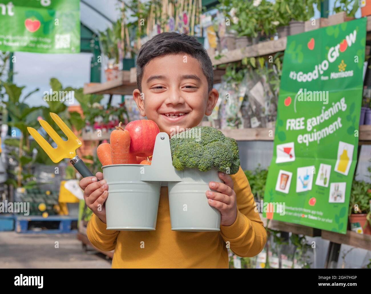 EDITORIAL USE ONLY Adam Hamidshoot, aged 6 visits Morrisons to launch the 'It's Good to Grow' campaign, which will see the supermarket donate £3.5 million of gardening equipment to schoolchildren across the UK to help to educate them about where their food comes from. Issue date: Monday September 6, 2021. Stock Photo
