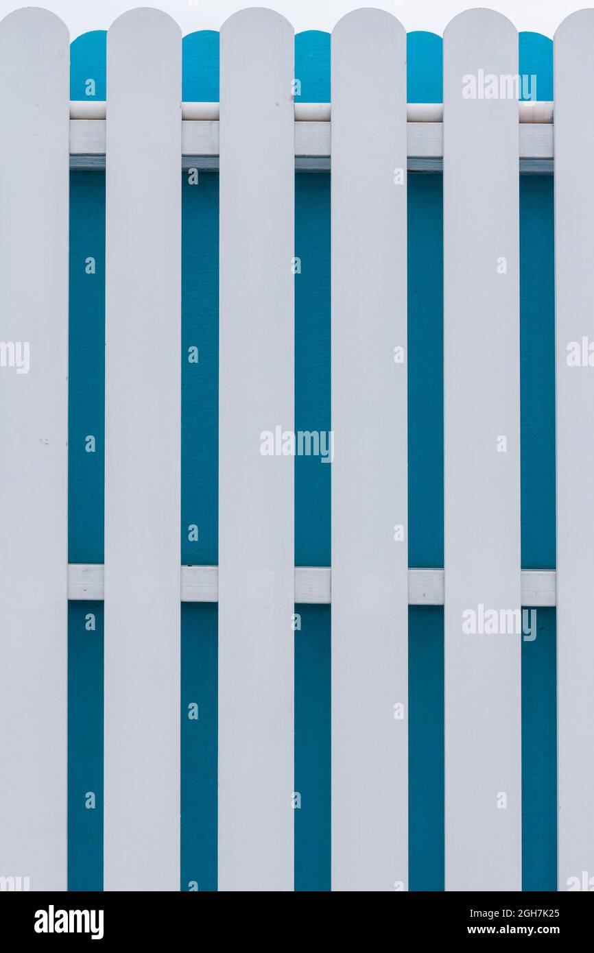 White and blue picket fence with sky background Stock Photo - Alamy
