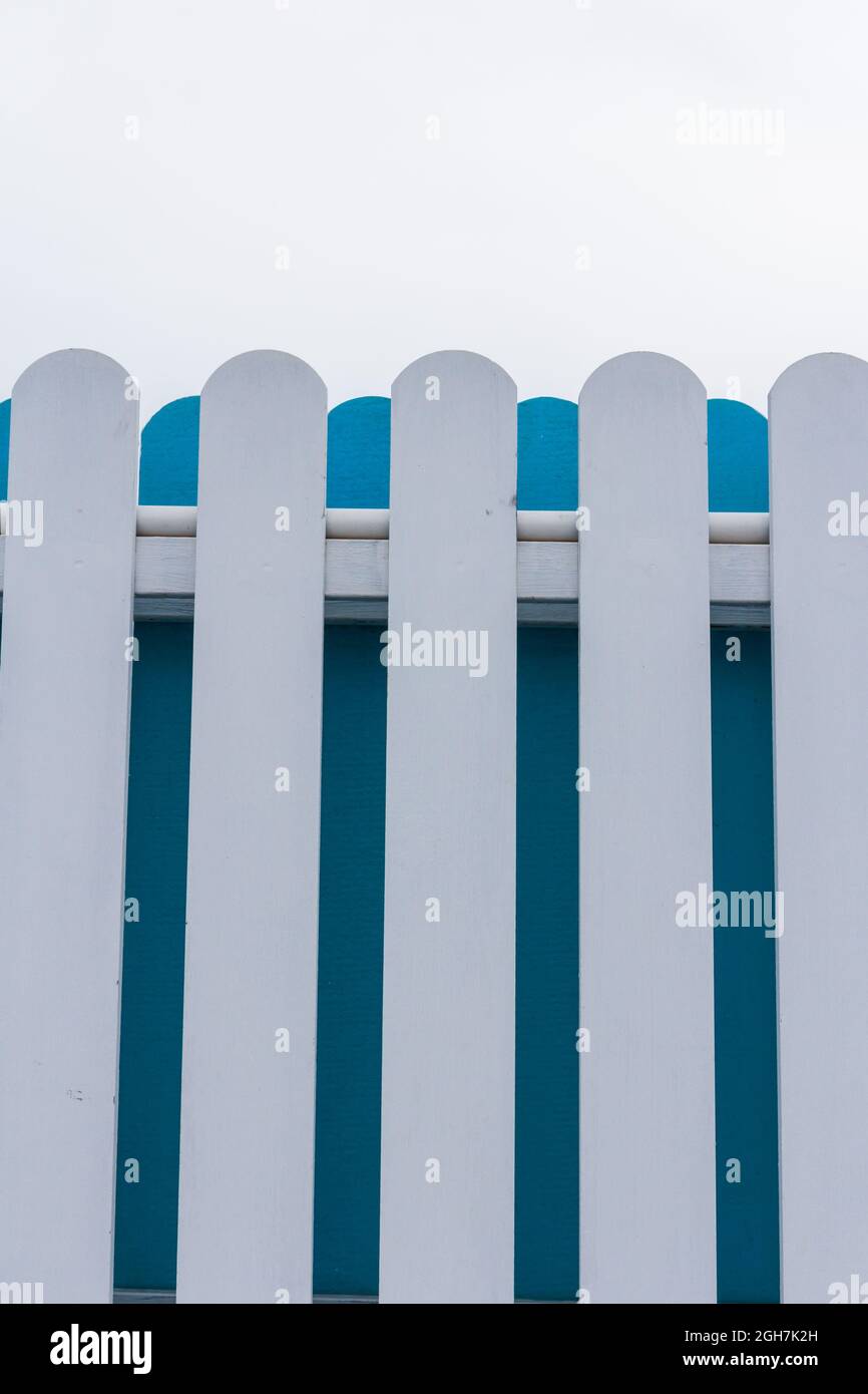 White and blue picket fence with sky background Stock Photo - Alamy